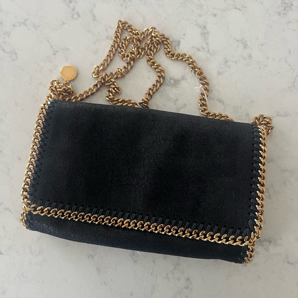 BNWT Stella MC Cartney Falabella small shoulder bag clutch. Black/Gold